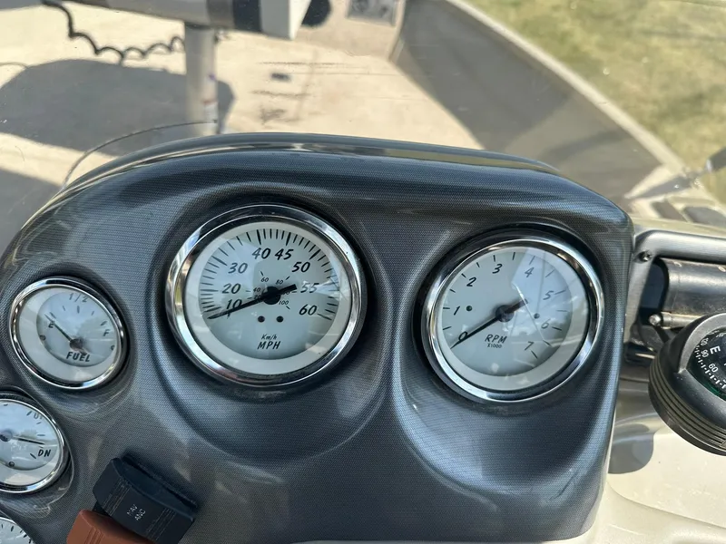 Slide: The Image of Dashboard of a 2007 Lowe Fishing Machine FM165S showing speedometer and RPM gauges. - 15