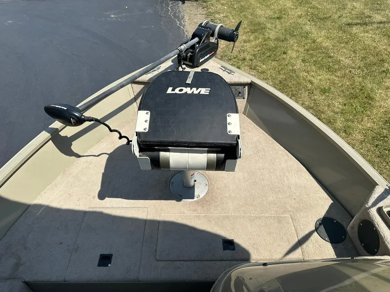 Slide: The Image of 2007 Lowe Fishing Machine FM165S boat deck with trolling motor and seat. - 17