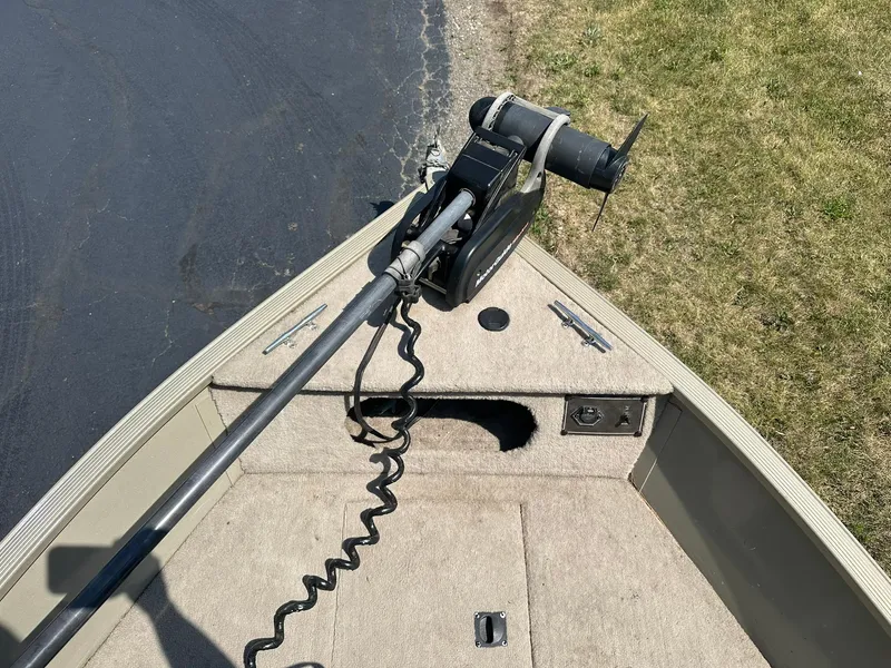 Slide: The Image of 2007 Lowe Fishing Machine FM165S boat with trolling motor on deck. - 19