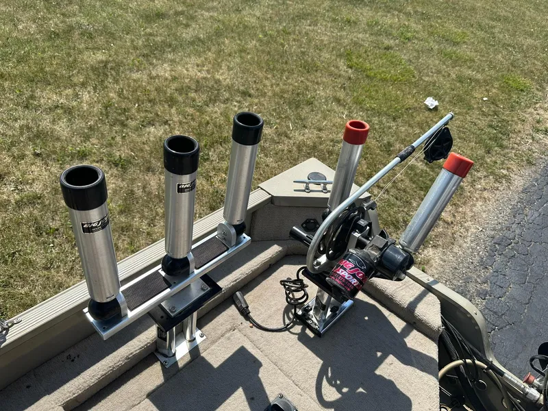 Slide: The Image of Fishing rod holders and equipment on a 2007 Lowe Fishing Machine FM165S boat deck. - 23