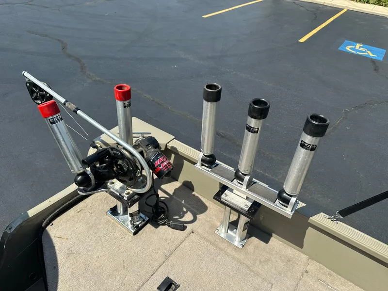 Slide: The Image of 2007 Lowe Fishing Machine FM165S with rod holders and downrigger on carpeted deck. - 24