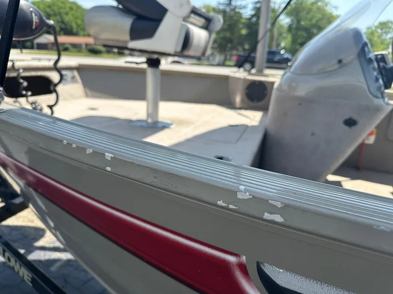 Slide: The Image of 2007 Lowe Fishing Machine FM165S boat interior with worn paint and seating. - 30