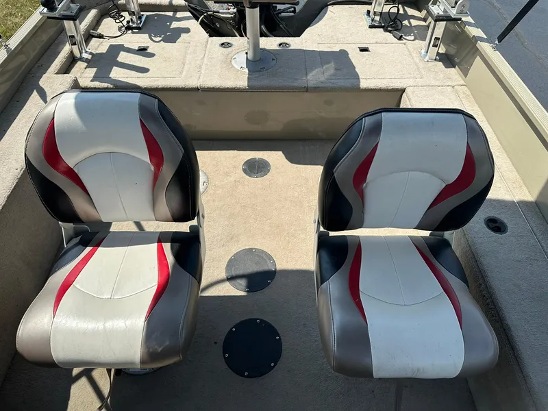 Slide: The Image of 2007 Lowe Fishing Machine FM165S interior with two cushioned seats. - 8