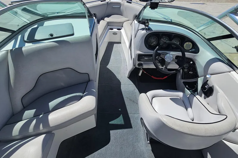 Slide: The Image of 2007 Supreme V232 boat interior with steering wheel and seating area. - 28