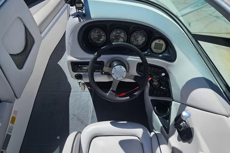 Slide: The Image of 2007 Supreme V232 boat dashboard with steering wheel and instrument panel. - 30