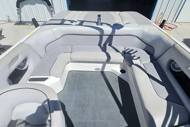 Slide: The Image of Interior of a 2007 Supreme V232 boat with gray seating and carpet. - 32