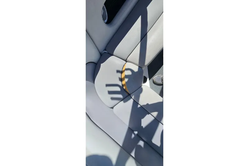 Slide: The Image of Interior of 2007 Supreme V232 boat with gray seating and shadow play. - 36