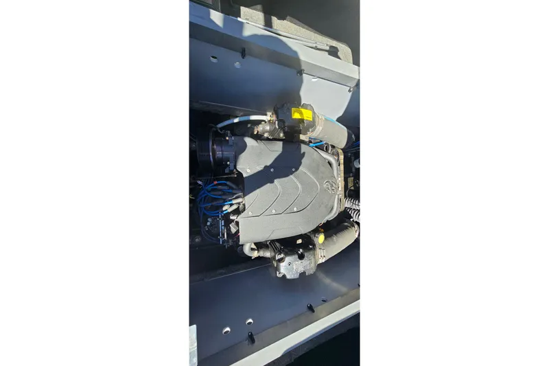 Slide: The Image of 2007 Supreme V232 boat engine compartment with visible components and wiring. - 38