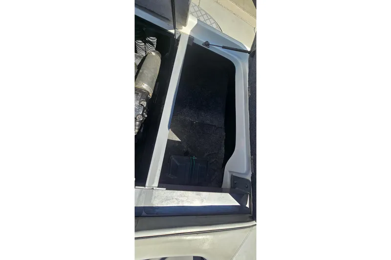 Slide: The Image of Open engine compartment of 2007 Supreme V232 boat, showing interior details. - 39