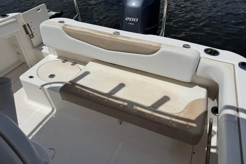 Slide: The Image of 2018 Robalo R222 Explorer boat interior with seating and Yamaha 200 engine. - 13
