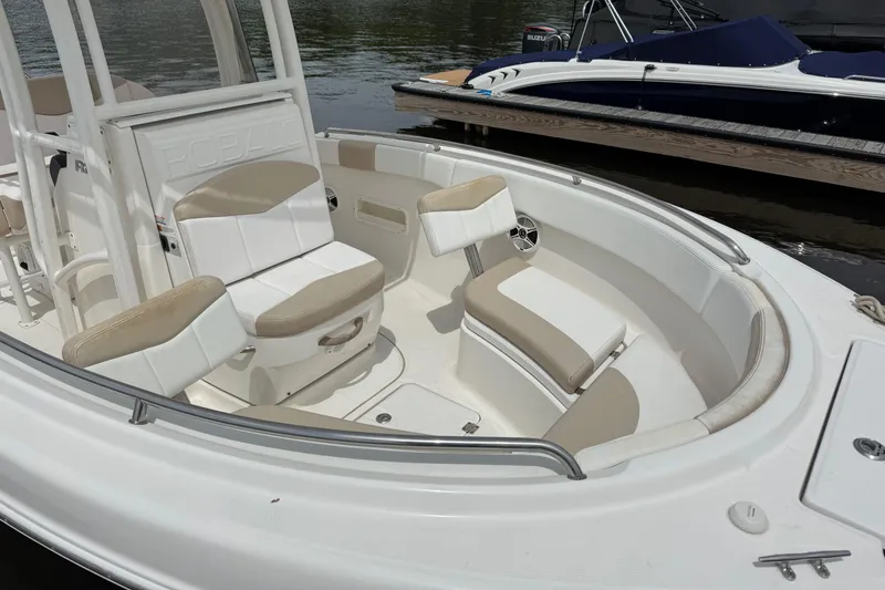 Slide: The Image of 2018 Robalo R222 Explorer boat interior with cushioned seating and sleek design. - 3