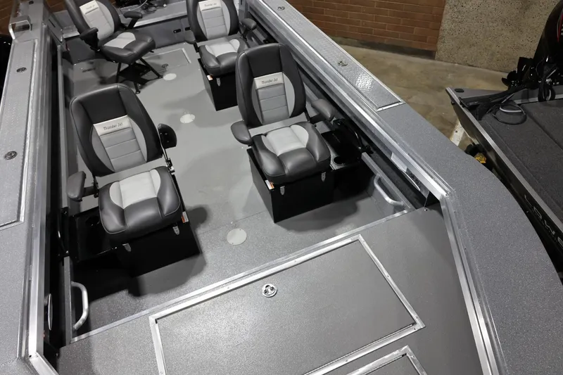 Slide: The Image of 2025 Thunder Jet 209 Rush OT boat interior with four cushioned seats. - 10