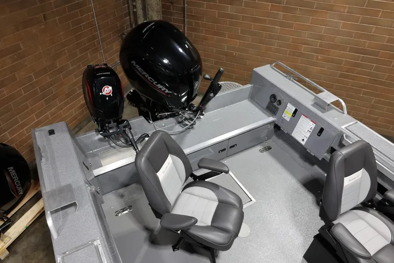 Slide: The Image of 2025 Thunder Jet 209 Rush OT boat interior with Mercury engines and seating. - 11