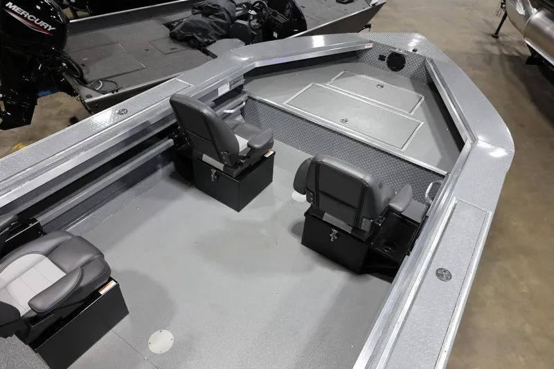 Slide: The Image of 2025 Thunder Jet 209 Rush OT boat interior with seating and storage compartments. - 12