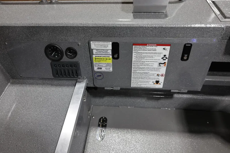 Slide: The Image of Control panel of 2025 Thunder Jet 209 Rush OT boat with gauges and safety instructions. - 14
