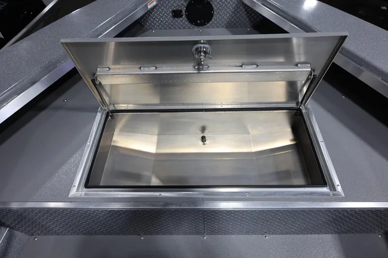 Slide: The Image of Open storage compartment on 2025 Thunder Jet 209 Rush OT boat. - 17