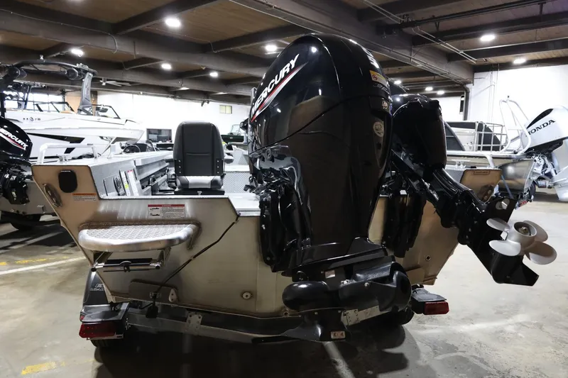 Slide: The Image of 2025 Thunder Jet 209 Rush OT boat with Mercury outboard motor in showroom. - 3