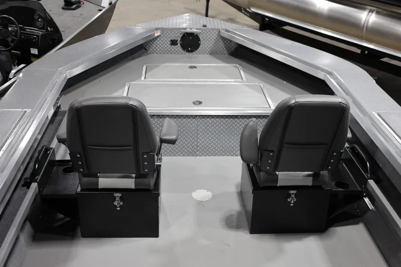 Slide: The Image of Interior of 2025 Thunder Jet 209 Rush OT boat with two black seats. - 6