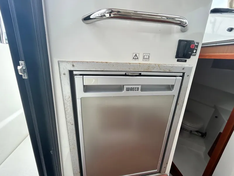 Slide: The Image of Waeco fridge inside 2015 Jeanneau Merry Fisher 855 Marlin boat cabin. - 10