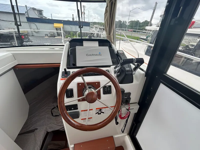 Slide: The Image of Helm of 2015 Jeanneau Merry Fisher 855 Marlin with Garmin navigation system. - 12