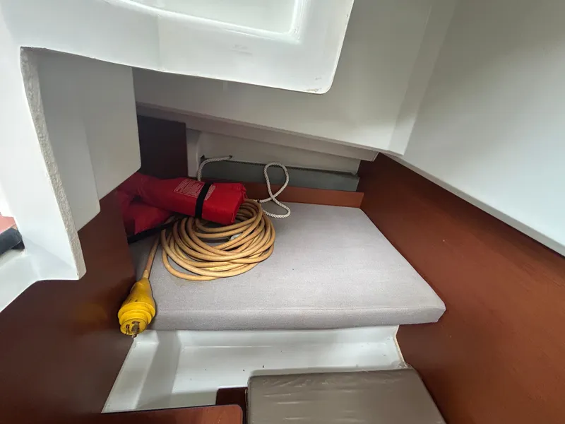 Slide: The Image of Interior of 2015 Jeanneau Merry Fisher 855 Marlin with coiled cable and life jacket. - 15