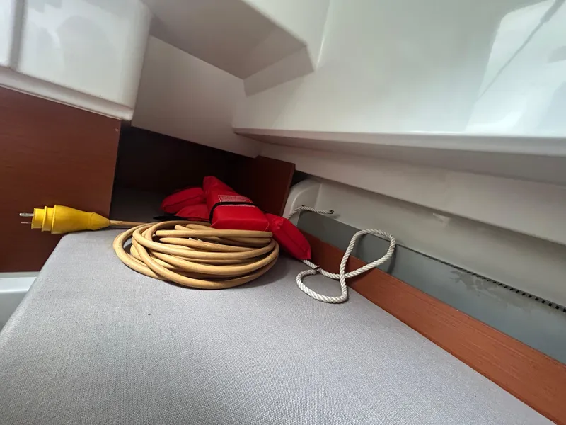 Slide: The Image of Interior of 2015 Jeanneau Merry Fisher 855 Marlin with coiled cable and life jackets. - 16
