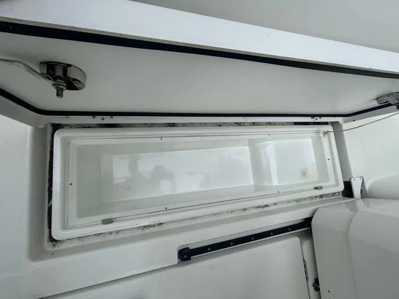 Slide: The Image of Open storage compartment on 2015 Jeanneau Merry Fisher 855 Marlin boat. - 19