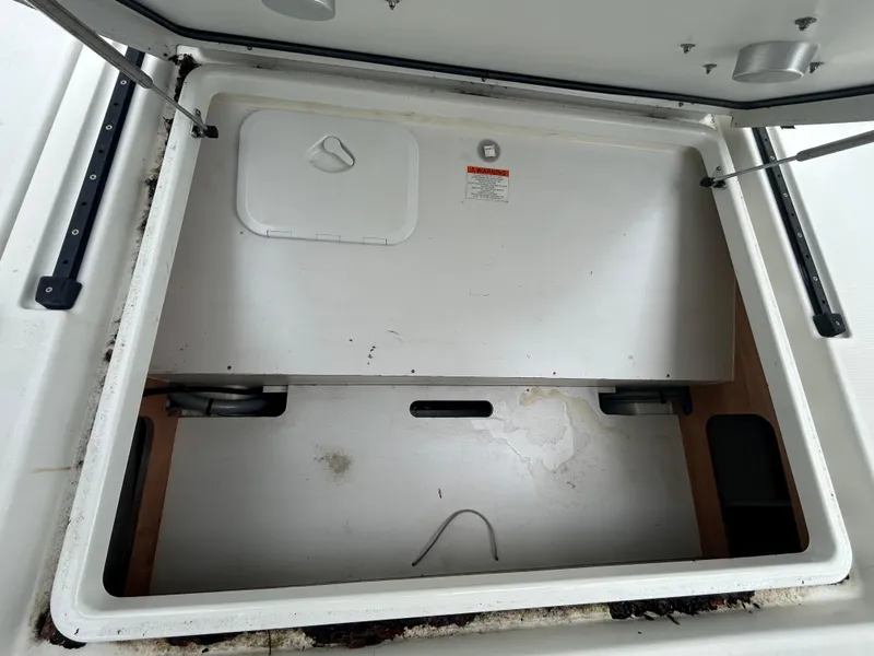 Slide: The Image of Open storage compartment on 2015 Jeanneau Merry Fisher 855 Marlin boat. - 20