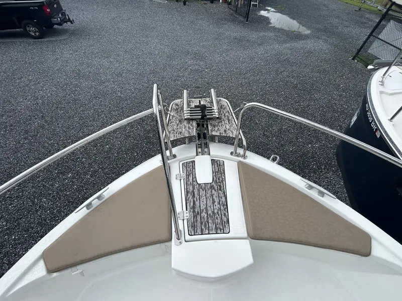 Slide: The Image of 2015 Jeanneau Merry Fisher 855 Marlin bow with anchor and cushioned seating. - 5