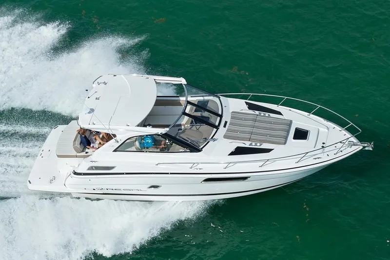 Slide: The Image of 2019 Regal 35 Sport Coupe cruising on open water. - 101