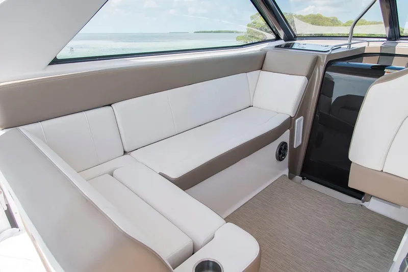 Slide: The Image of 2019 Regal 35 Sport Coupe interior seating with scenic water view. - 108