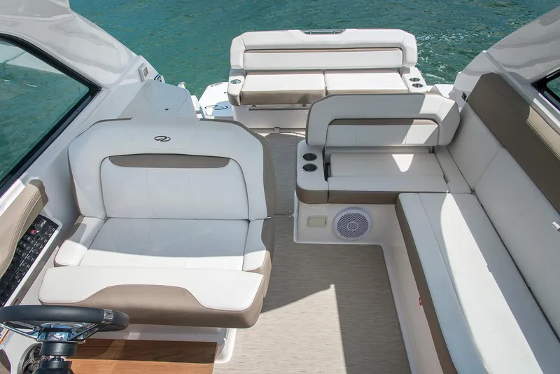 Slide: The Image of 2019 Regal 35 Sport Coupe boat interior with white and beige seating. - 109