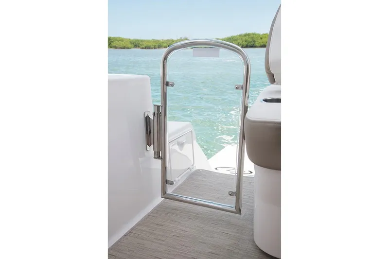 Slide: The Image of 2019 Regal 35 Sport Coupe boat with open glass door, overlooking water. - 113