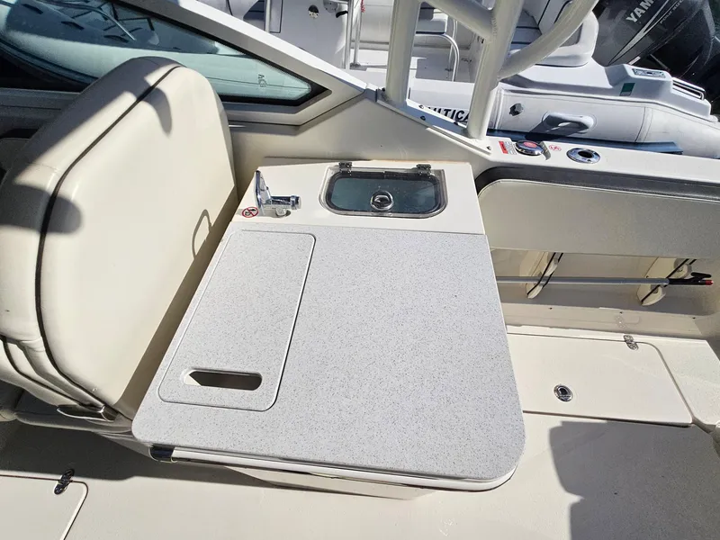Slide: The Image of 2020 Stingray 269 DC boat interior with sink and seating area. - 16