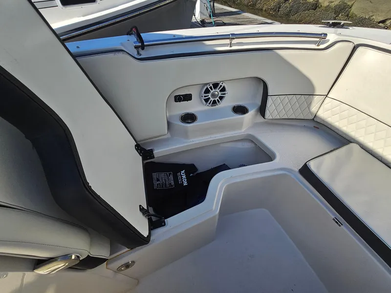 Slide: The Image of Interior of 2020 Stingray 269 DC boat with seating and storage compartments. - 7