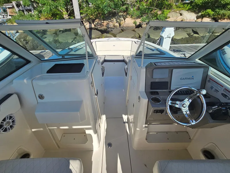 Slide: The Image of 2020 Stingray 269 DC boat interior with Garmin navigation system and dual consoles. - 8