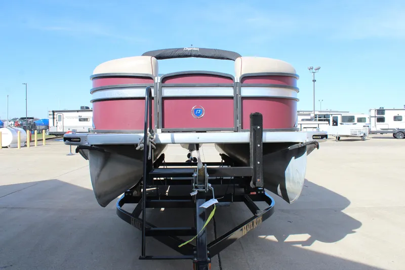 Slide: The Image of 2015 Premier 220 SunSation pontoon boat on trailer, parked in a lot. - 2