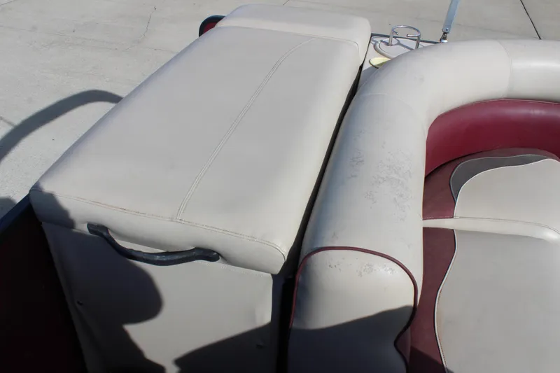 Slide: The Image of Premier 220 SunSation 2015 boat seating with white and maroon upholstery. - 20