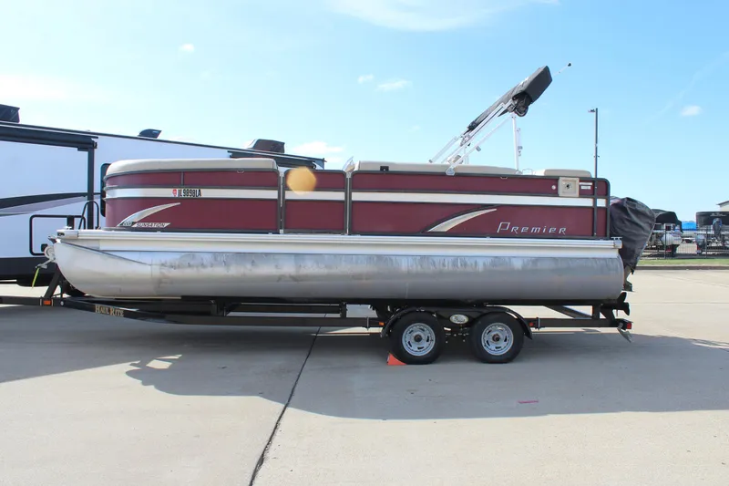 Slide: The Image of 2015 Premier 220 SunSation pontoon boat on trailer, parked outdoors. - 4