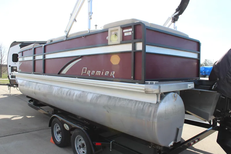 Slide: The Image of 2015 Premier 220 SunSation pontoon boat on trailer, maroon and silver design. - 5