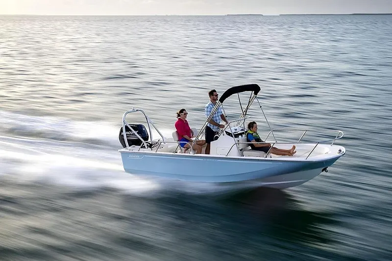 Slide: The Image of 2026 Boston Whaler 170 Montauk cruising on open water with passengers enjoying the ride. - 6