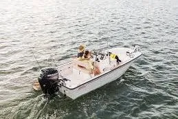 Slide: The Image of 2026 Boston Whaler 170 Montauk boat on water, featuring fishing gear and passengers. - 8