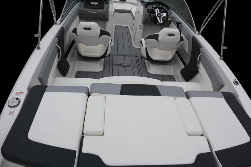 Slide: The Image of 2024 Chaparral 19 SSi OB boat interior with modern seating and steering wheel. - 4