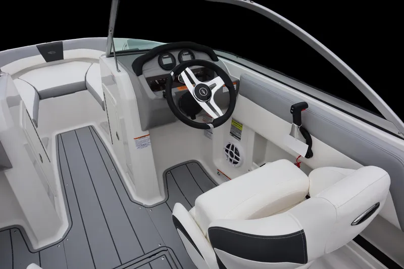 Slide: The Image of 2024 Chaparral 19 SSi OB boat interior with steering wheel and seating. - 6