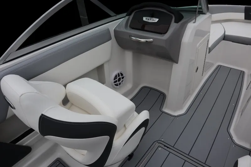 Slide: The Image of 2024 Chaparral 19 SSi OB boat interior with sleek seating and modern dashboard design. - 8