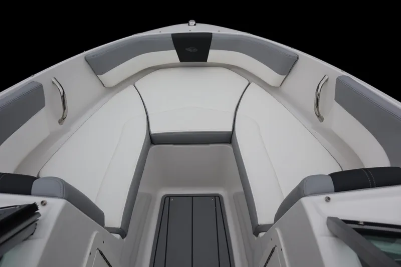 Slide: The Image of 2024 Chaparral 19 SSi OB boat interior with cushioned seating and stainless steel handles. - 9