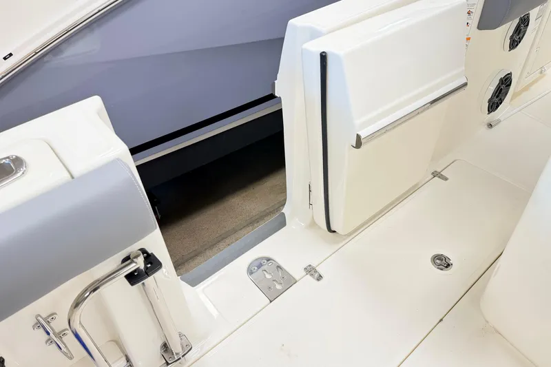 Slide: The Image of 2026 Boston Whaler 280 Outrage boat interior, featuring open storage compartment and sleek design. - 10