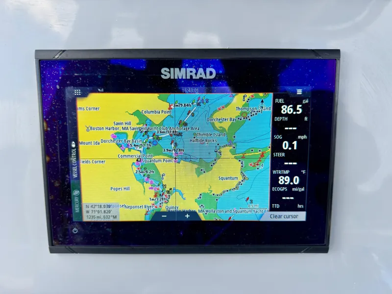 Slide: The Image of Simrad navigation display on 2023 Bayliner Trophy T24CC boat showing nautical map and data. - 16