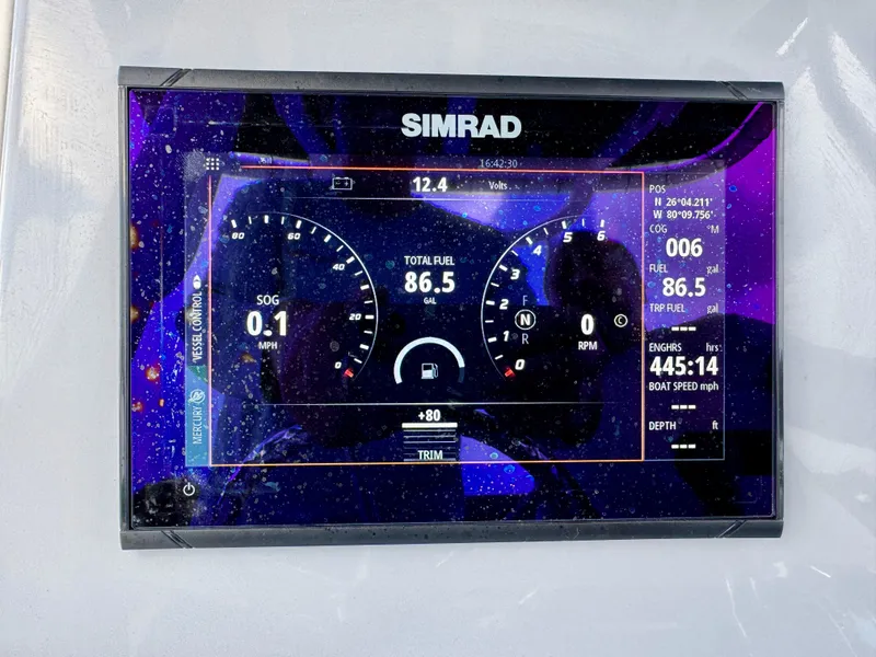 Slide: The Image of Simrad display on 2023 Bayliner Trophy T24CC showing speed, fuel, and navigation data. - 17