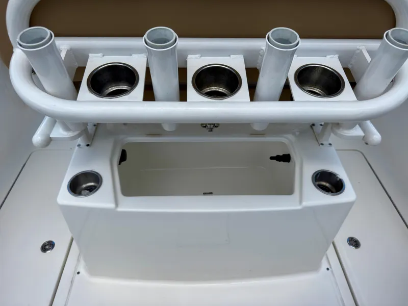 Slide: The Image of 2023 Bayliner Trophy T24CC fishing rod holders and storage compartment. - 24